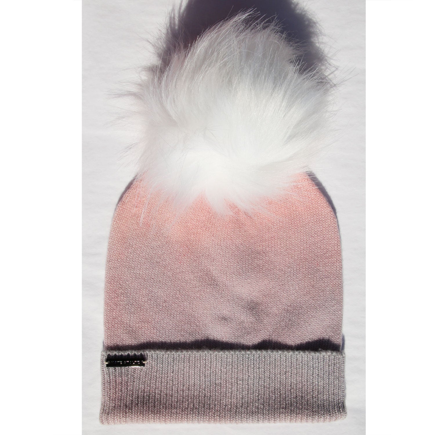 Knitted beanie with gradient lavender pink color and white fur pom-pom 