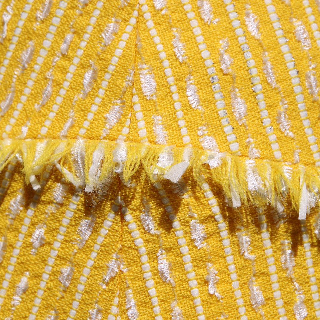 closeup yellow-and-white-tweed-a-line-skirt
